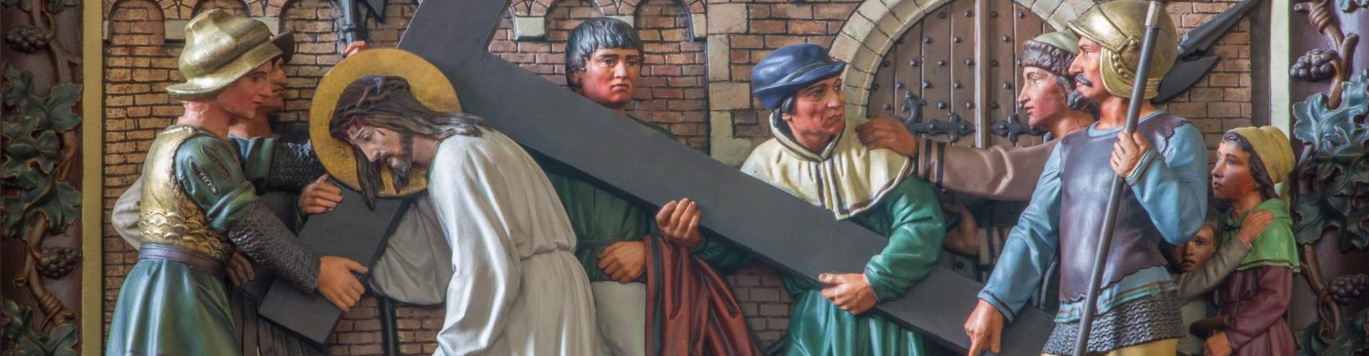 Setena estació: Jesús és carregat amb la creu